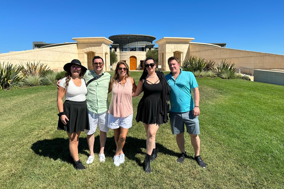 2022, Teresa enjoys a visit to a winery with her children and their significant others.