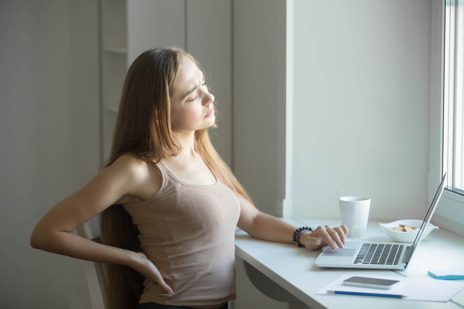 3 Stretches to Ease Midday Back Pain