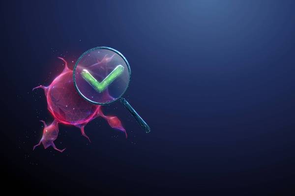 3d tumor under magnifying glass with green check mark