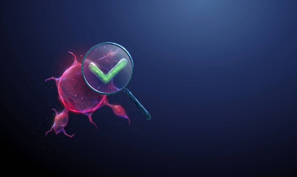 3d tumor under magnifying glass with green check mark