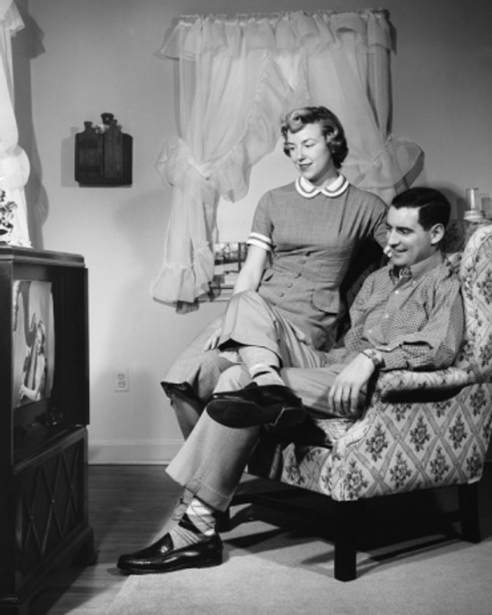 50's couple watching tv