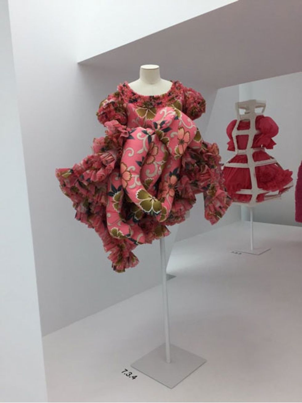 7.3.4 Child/Adult: "Focuses on ensembles that not only challenge the rules of age-appropriate dressing but also engage the concept of kawaii (cuteness)\u2014a key aspect of Japanese popular culture." This pink floral dress features an oversize stuffed teddy bear camouflaged within frills. (Spring/summer 2014).