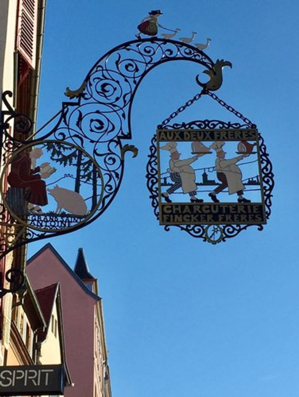 A whimsical Hansi street sign.