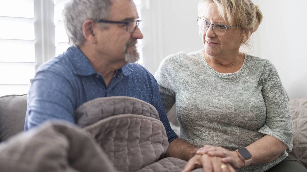 A wife caregiver taking care of her husband