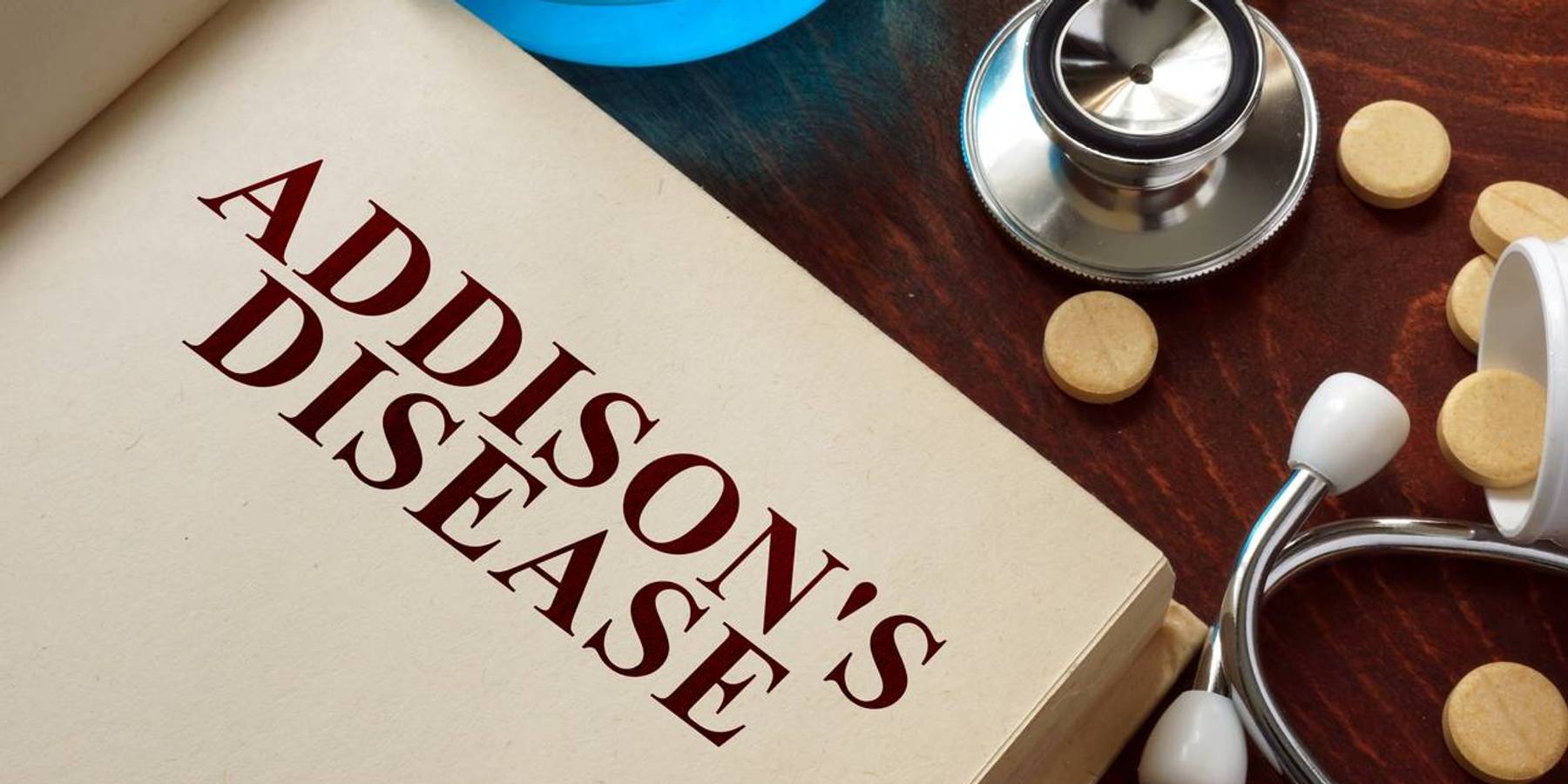 Addisons disease written on book with tablets