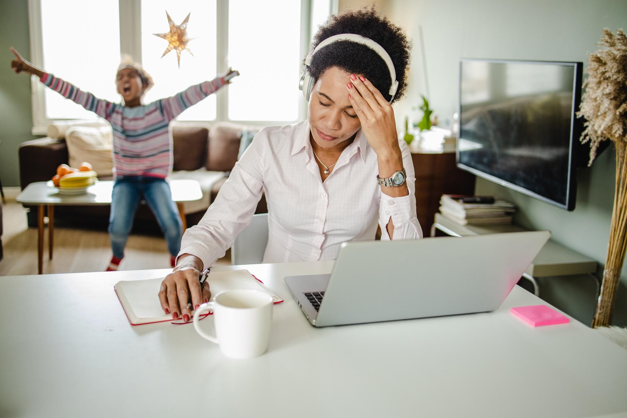 African American mother is working from home