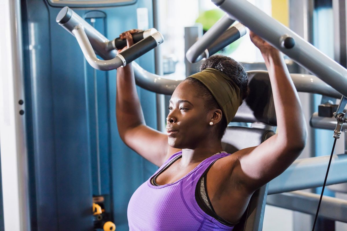 African-American woman working out at the gym