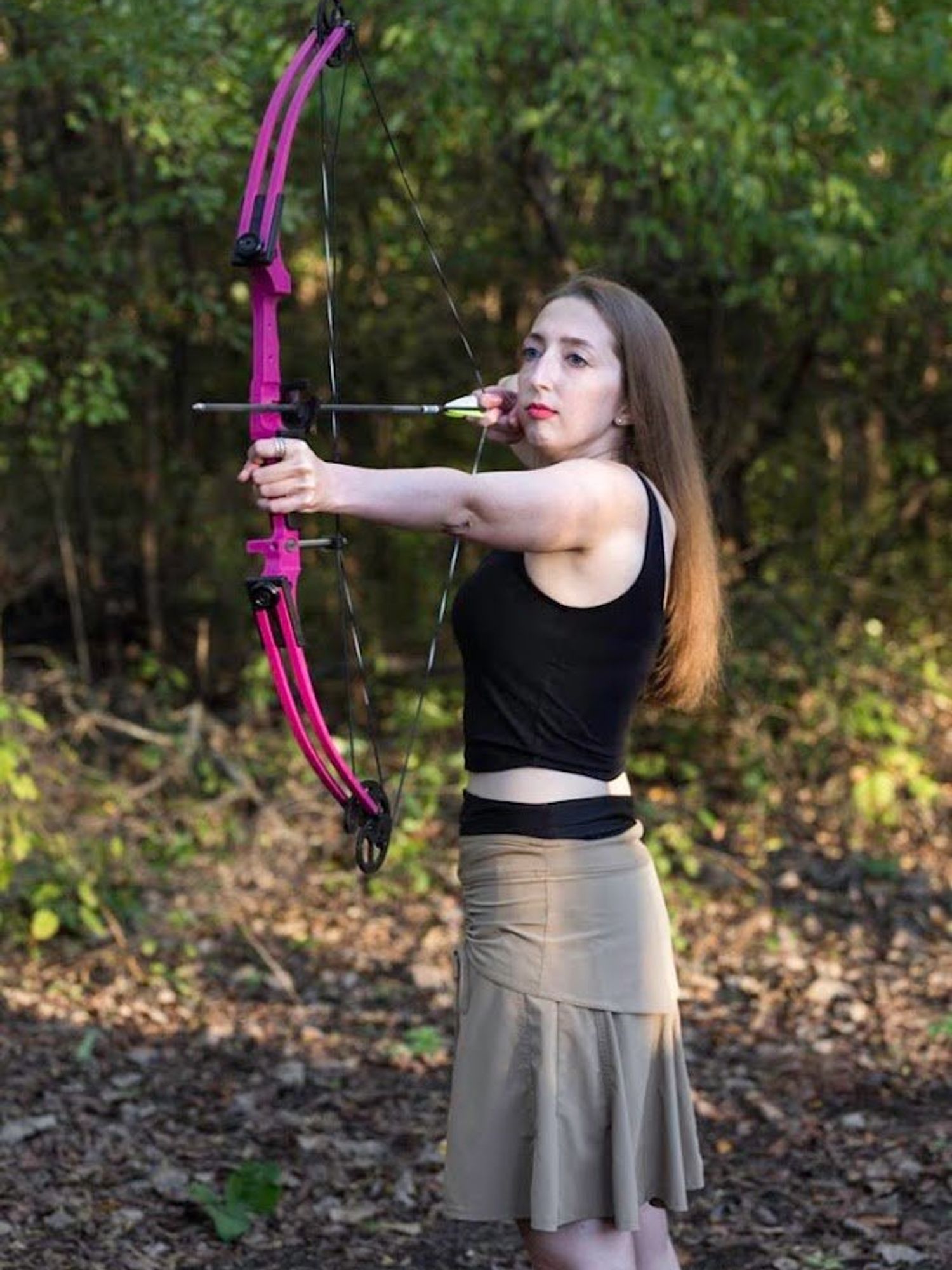 Alyssa Zeldenrust shooting a bow and arrow
