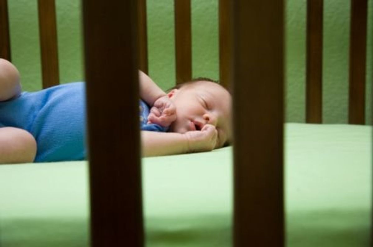 baby sleeping in a crib