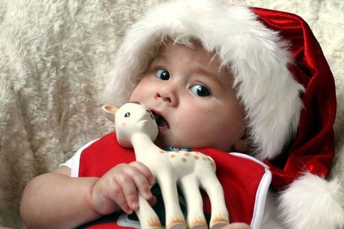 baby wearing a santa hat