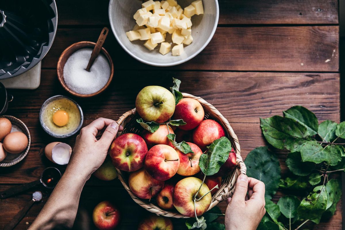 basket of apples and other food