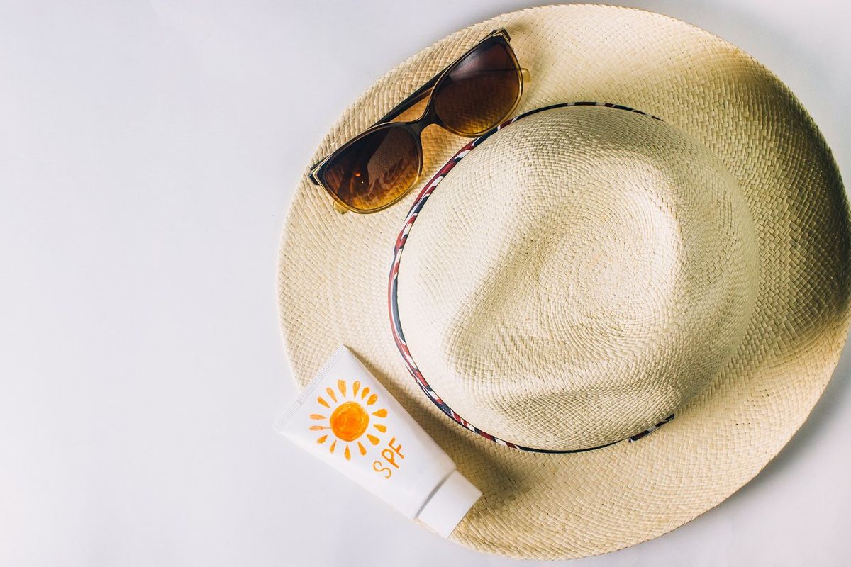 Beach accessories. hat, sunglasses and suntan lotion