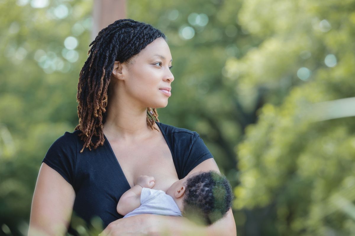 black mother breastfeeding her baby
