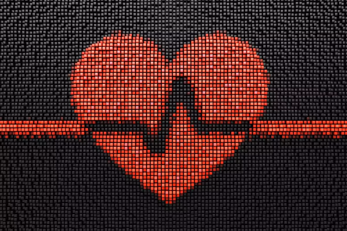 Black pixelated background with red heart and pulse trac