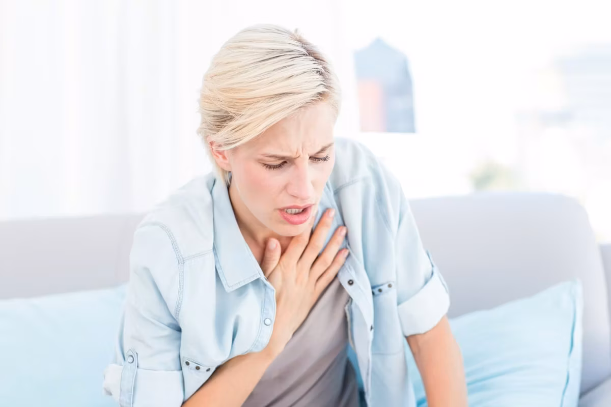 blonde woman having breath difficulties