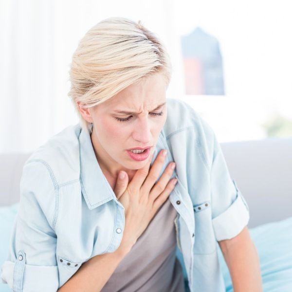 blonde woman having breath difficulties