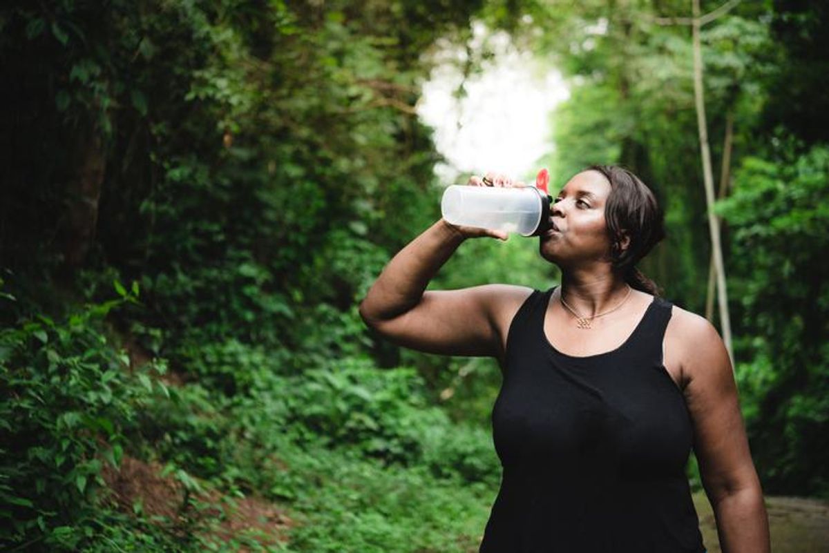 Body positive woman hydrating