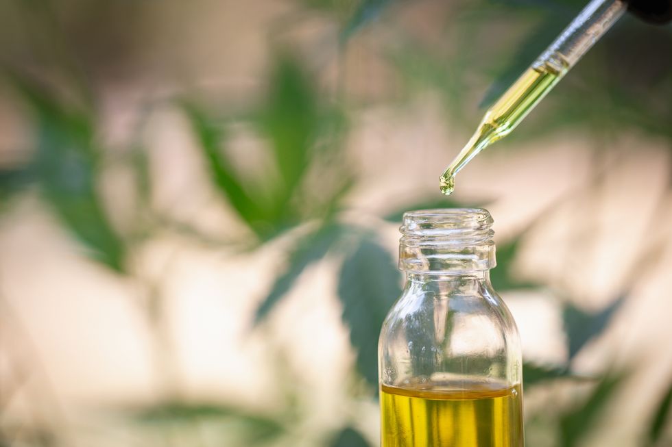 bottle of cbd oil with dropper