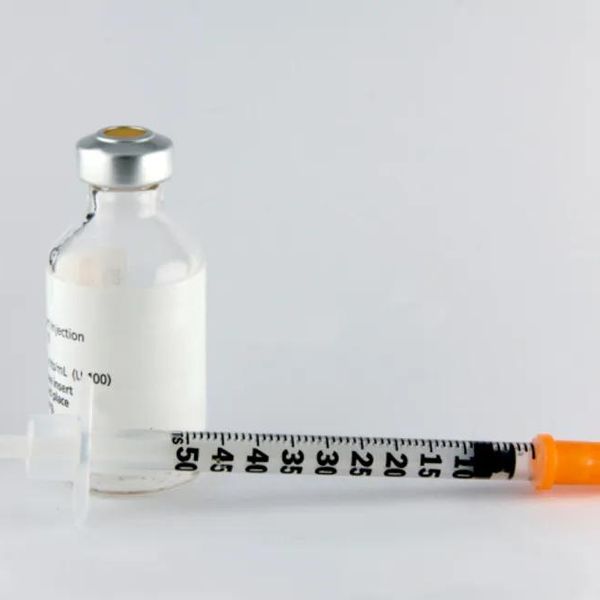 bottle of insulin and needle