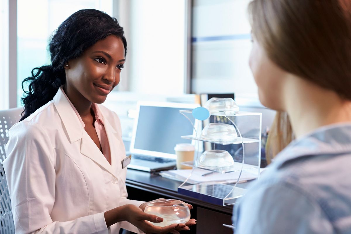 Breast Surgery Consultant Meeting With Female Patient