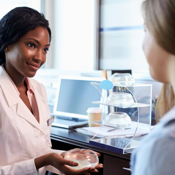 Breast Surgery Consultant Meeting With Female Patient