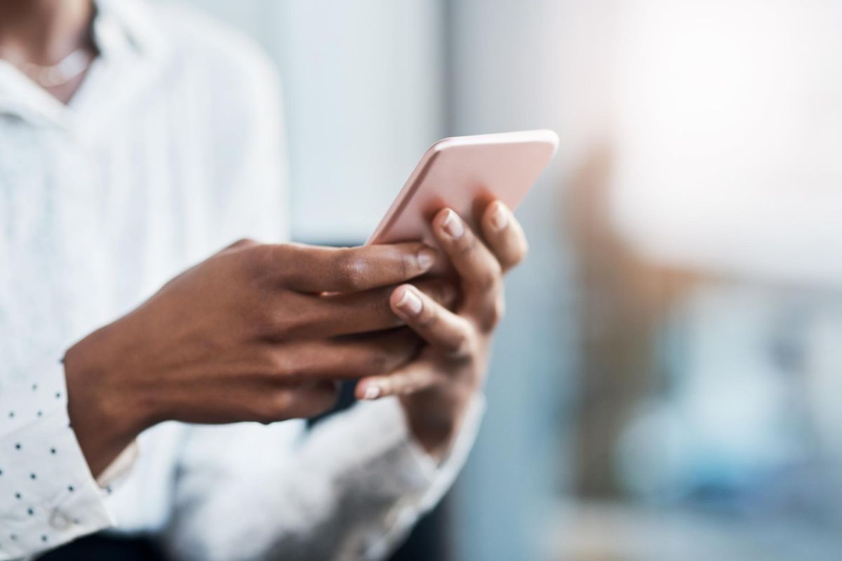 businesswoman using a mobile phone in a modern office