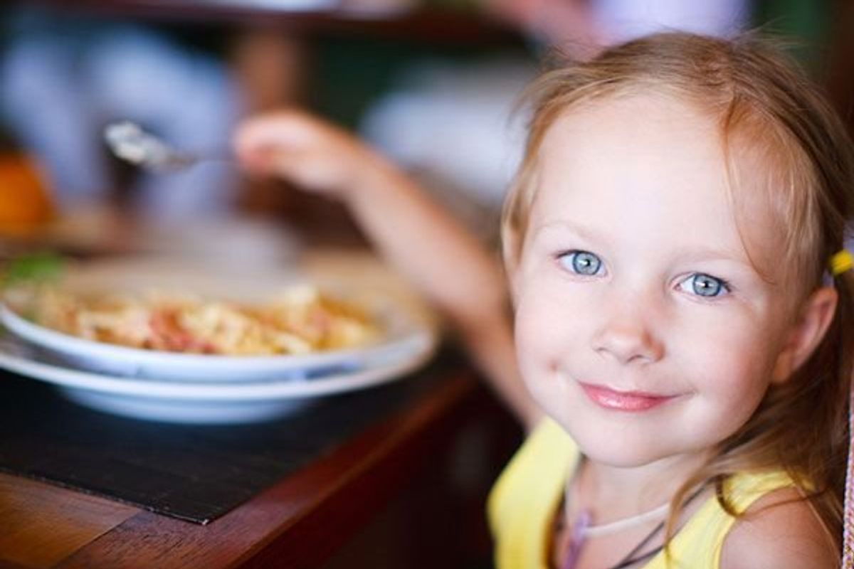 child eating at a restaurant