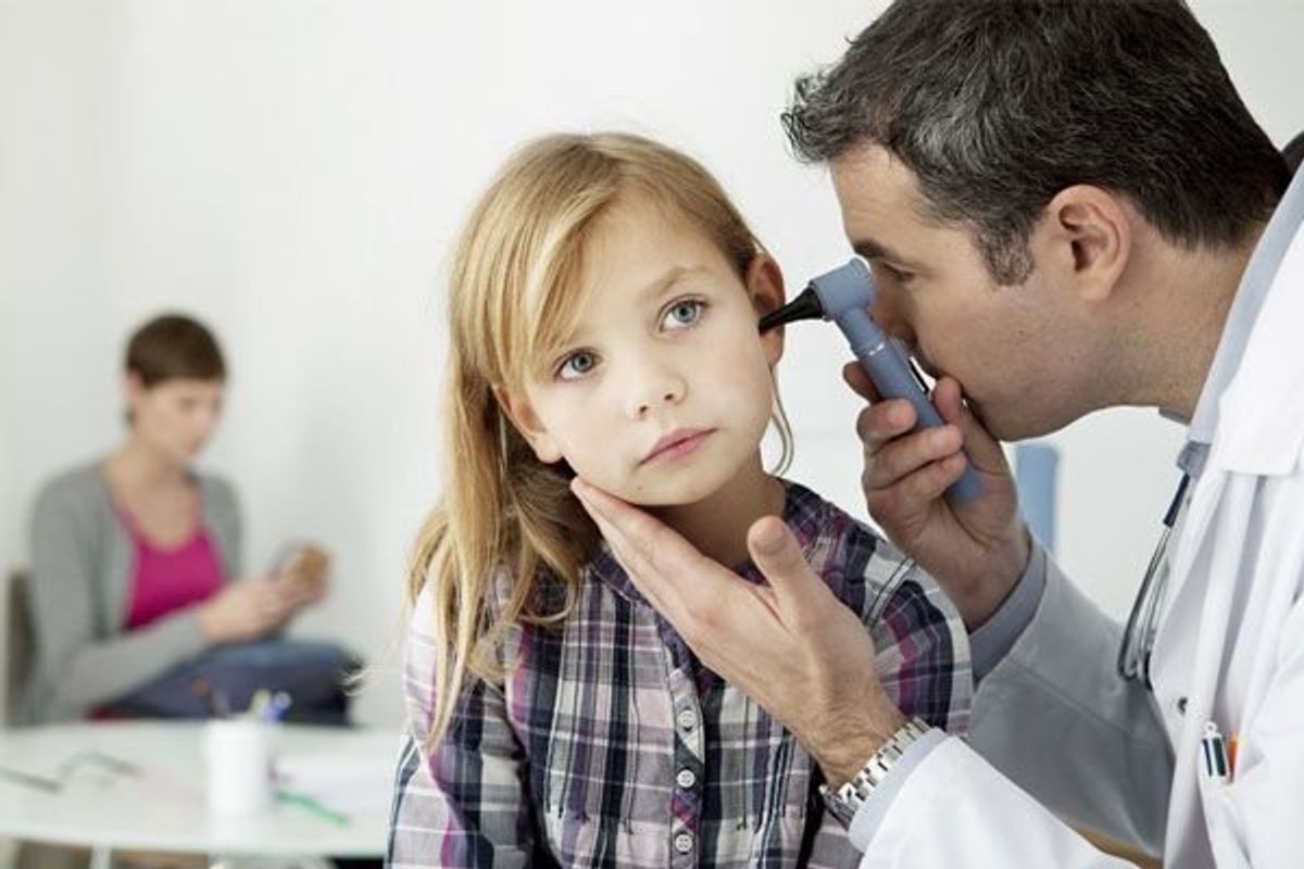 child getting their ears checked