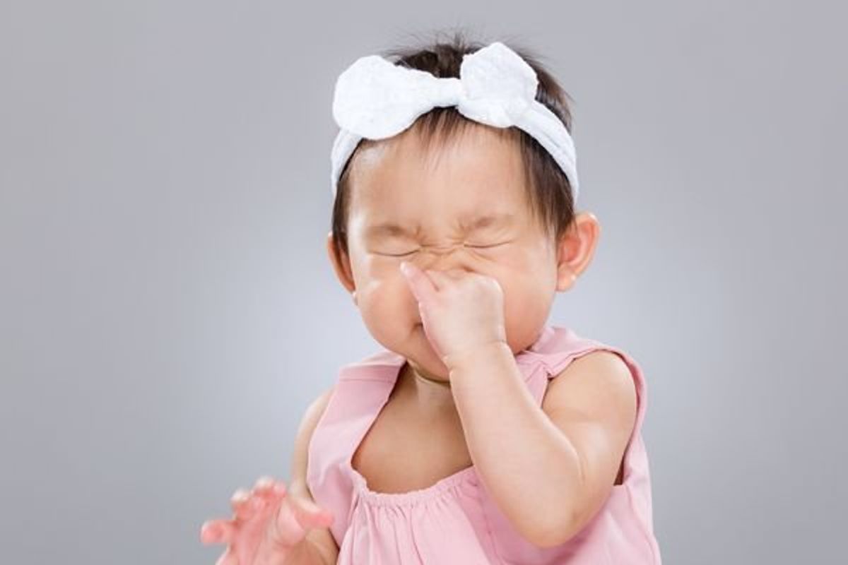 child sneezing from allergies