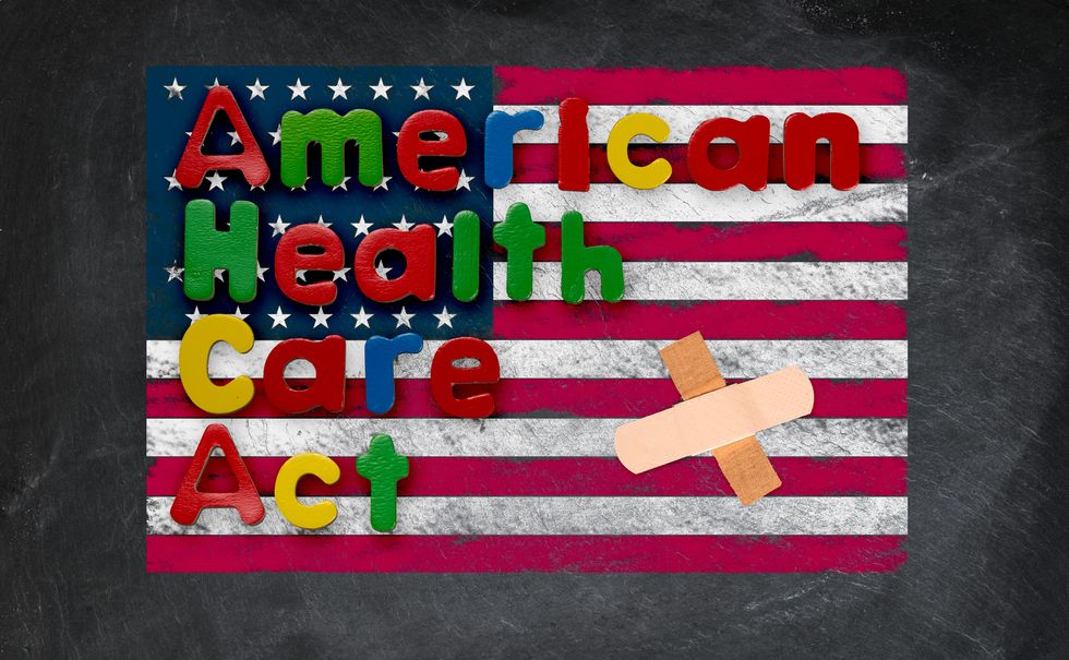 Childs magnetic letters spell American Health Care Act in congress