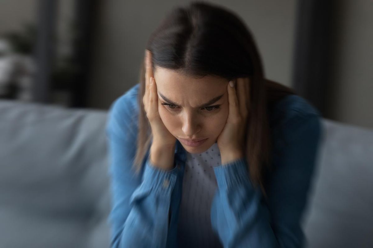 Close up unhappy woman suffering from strong headache