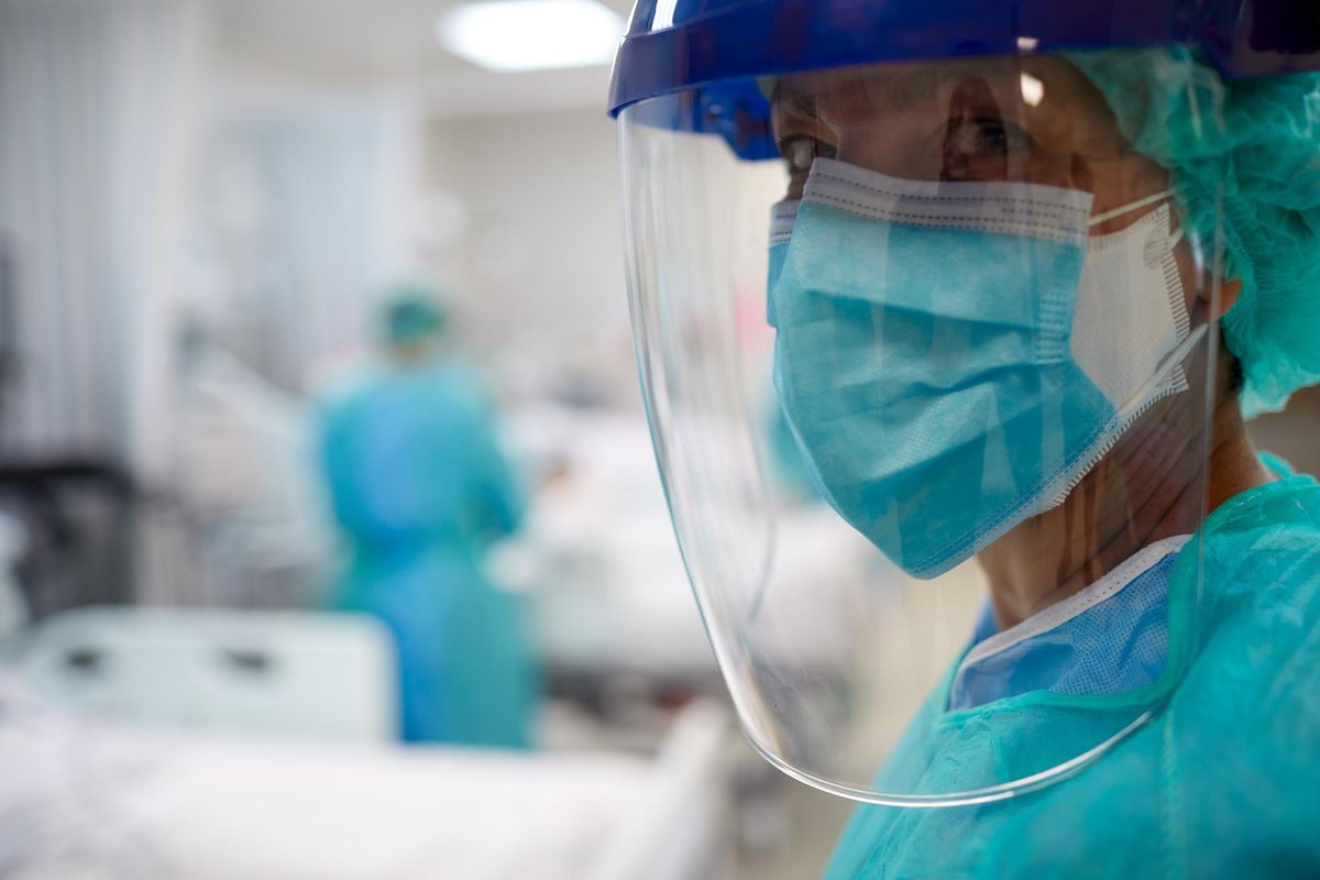 Close up view of a doctor wearing surgical mask