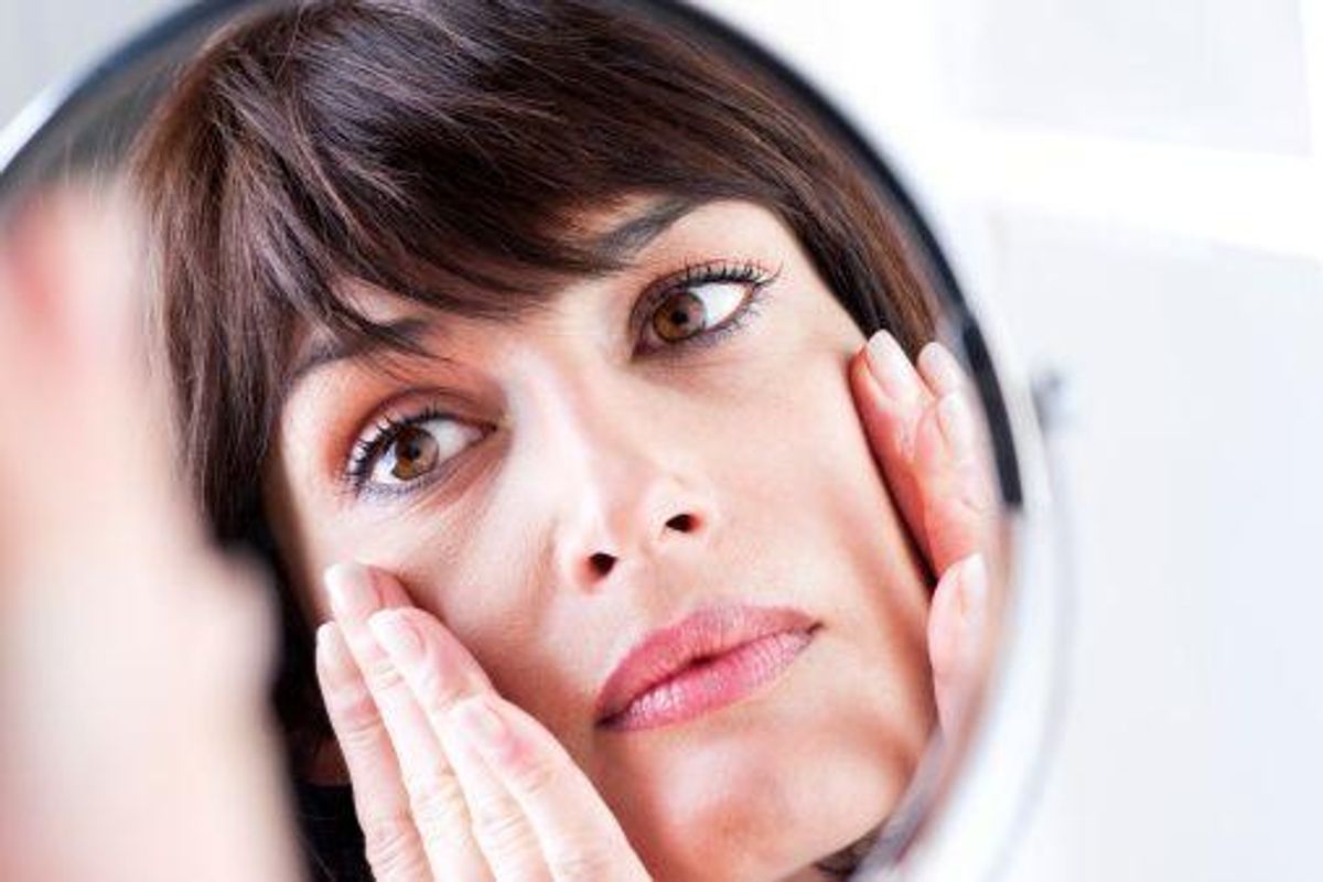 closeup of a woman in the mirror