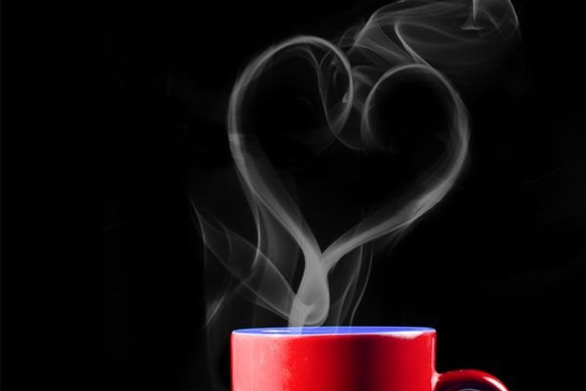 coffee mug with steam rising in the shape of a heart