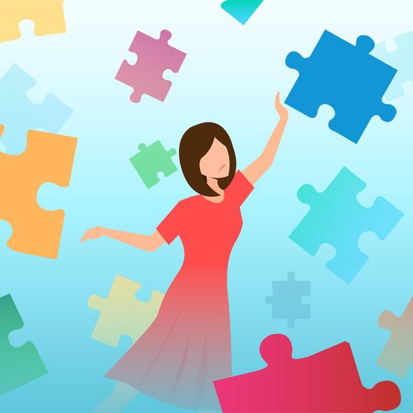 confused sad woman trying to assemble puzzle pieces