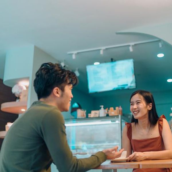 couple dating in a cafe over gelato