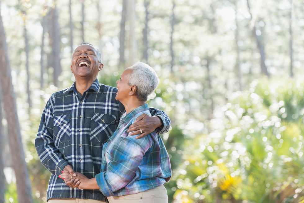 couple holding hands in park
