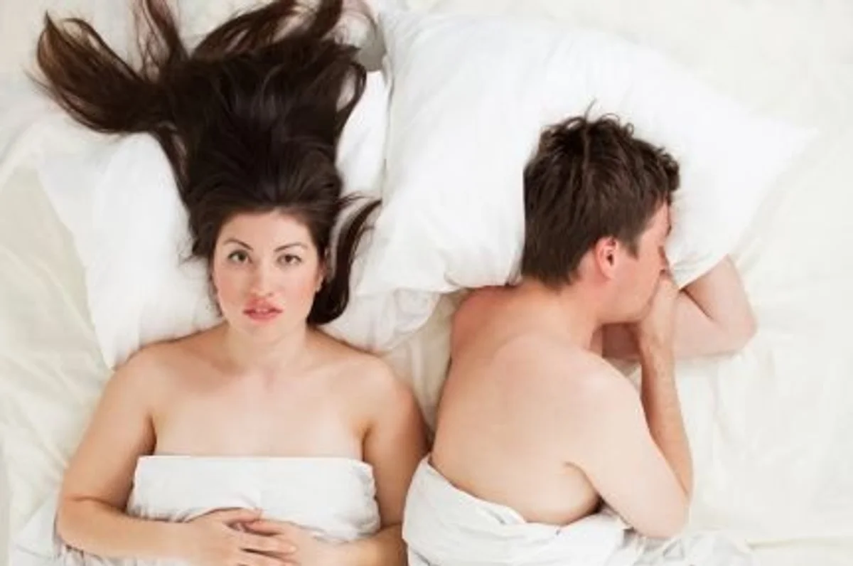 couple in bed after an awkward sex moment