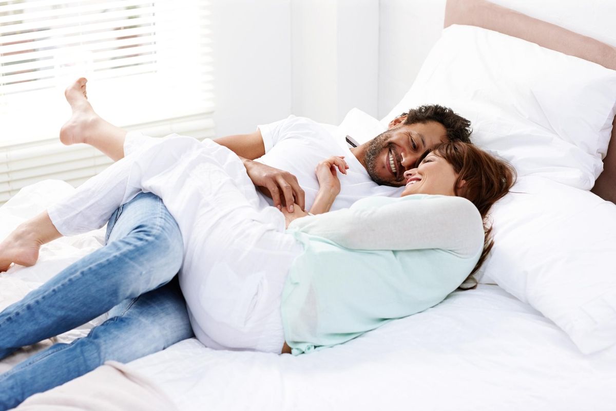 Couple in romantic mood on bed