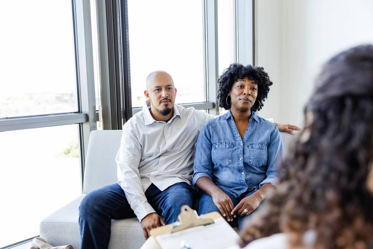 couple listening to marriage counselor