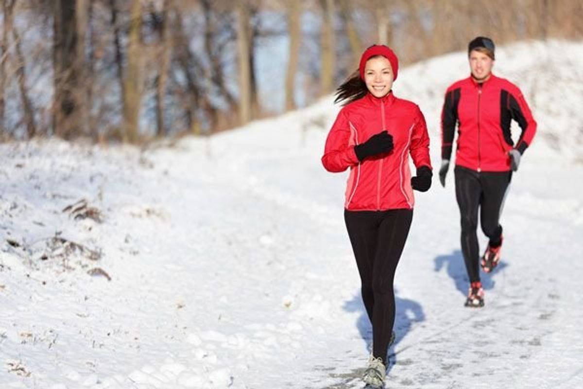 couple running in snow