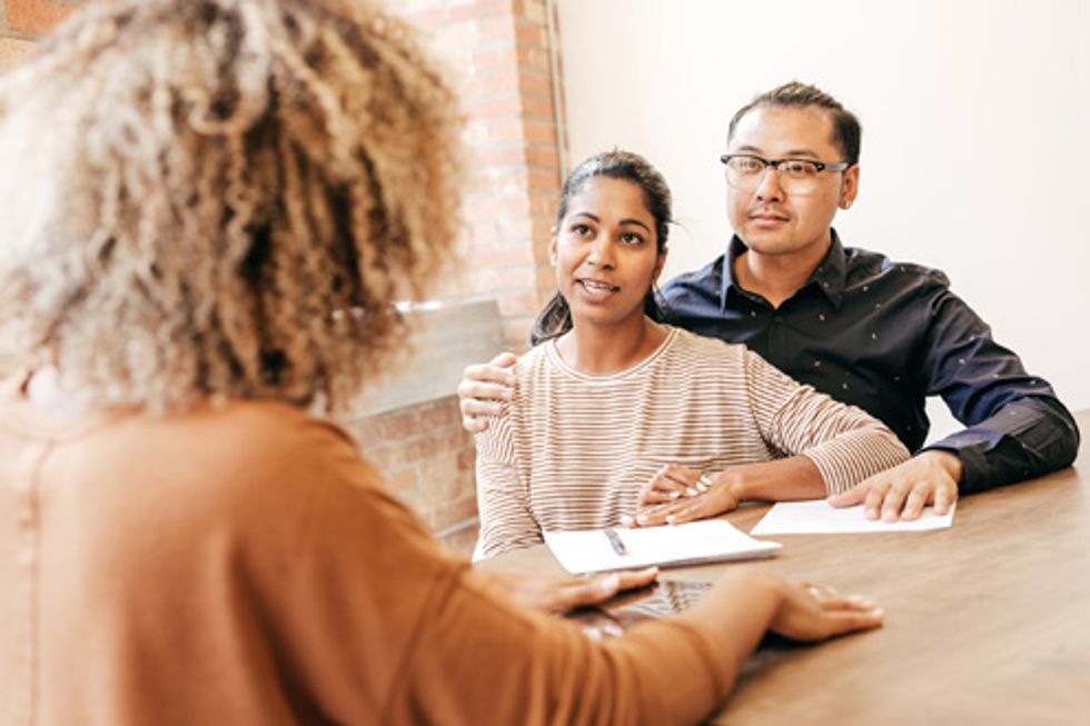 couple talking to a fertility doctor