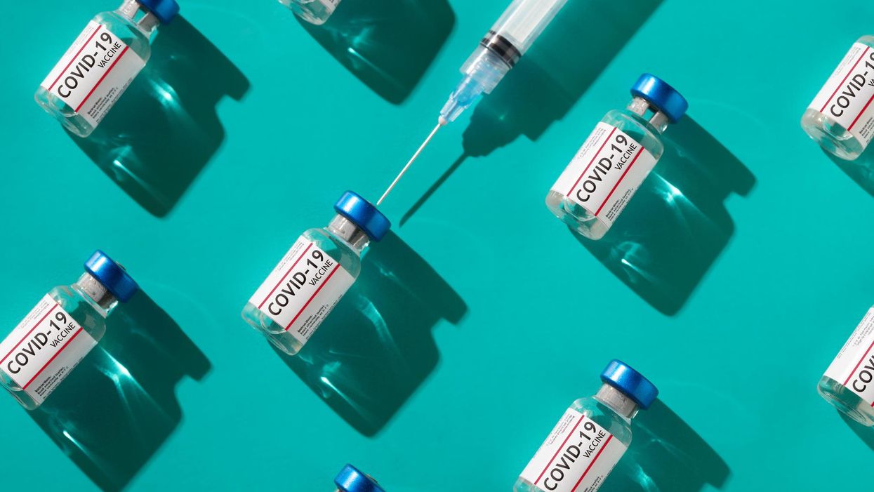 Covid 19 coronavirus vaccine vials with syringe