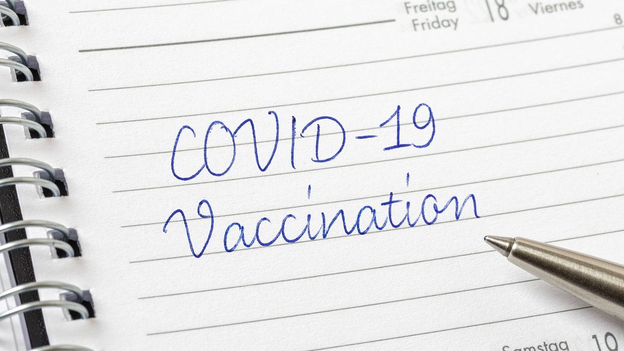 COVID-19 Vaccination written on a calendar page