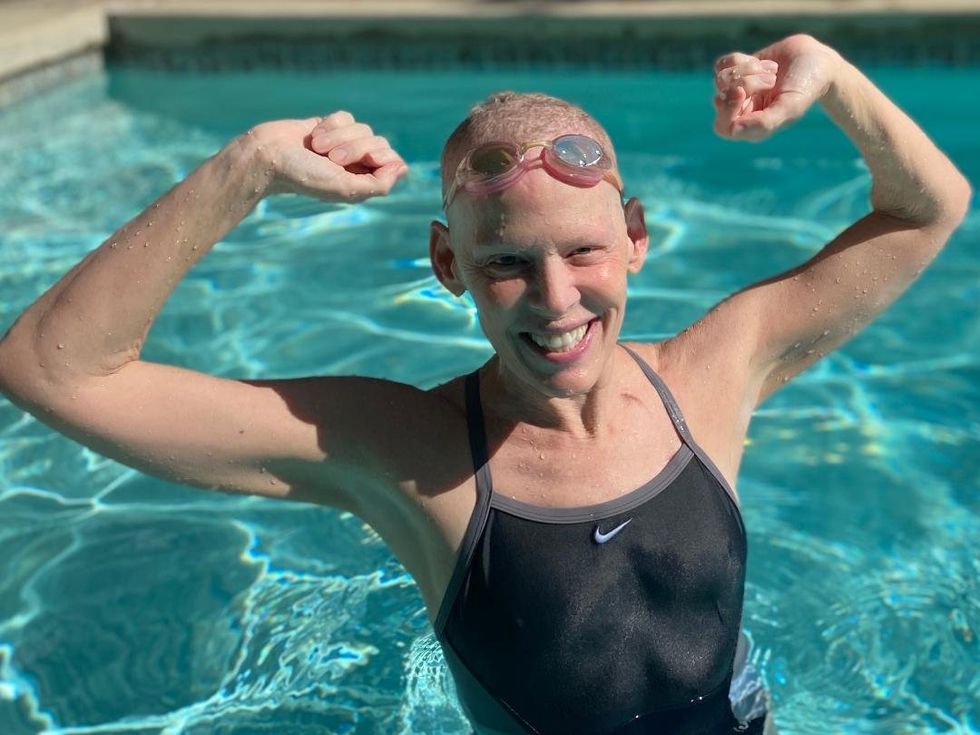 Cynthia cheering in the pool.