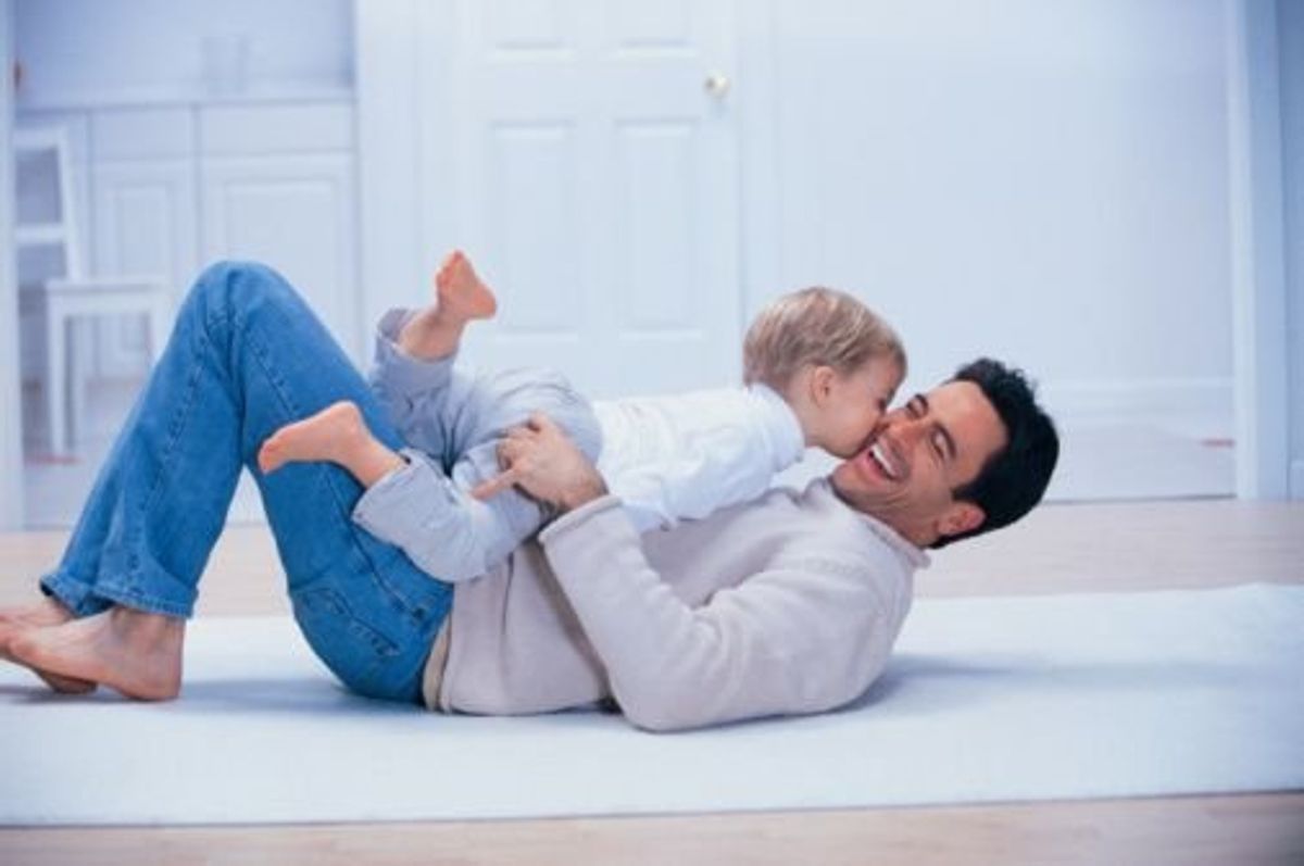 dad playing with his child