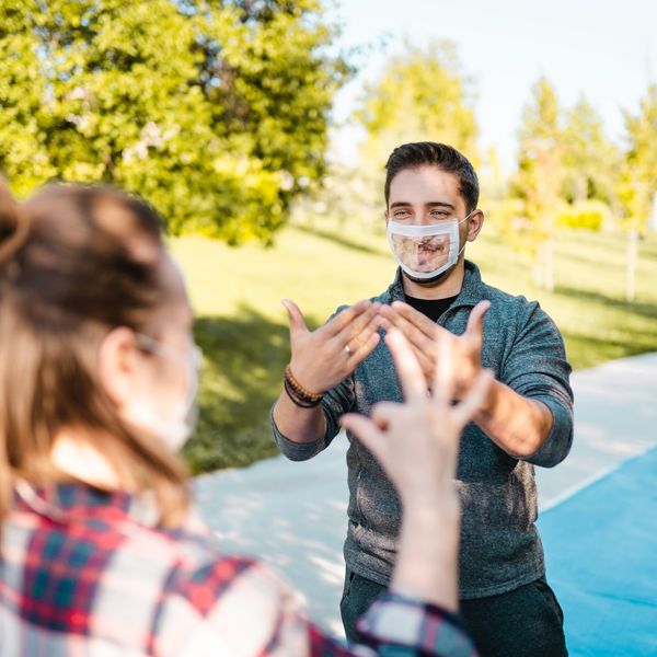 Deaf and hard hearing Young Adults wearing special face mask for lip-reading