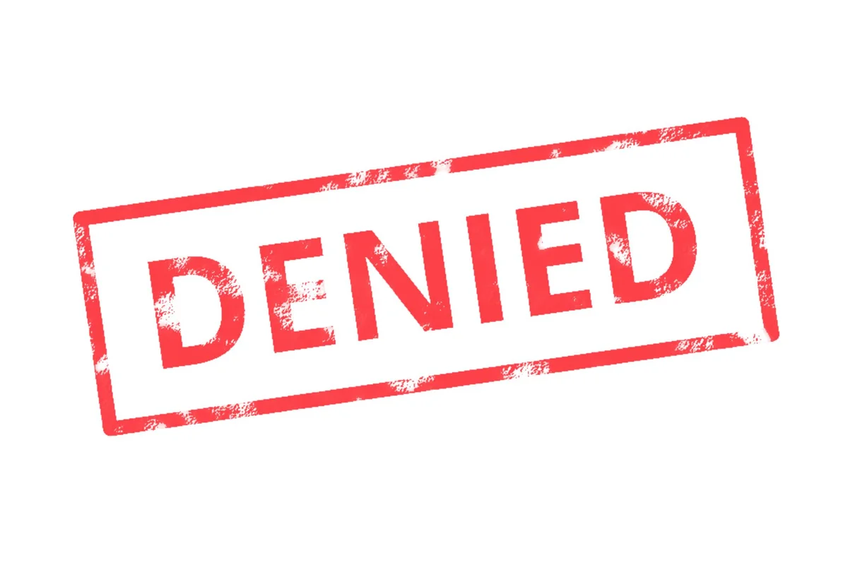 "DENIED" red stamp on white background