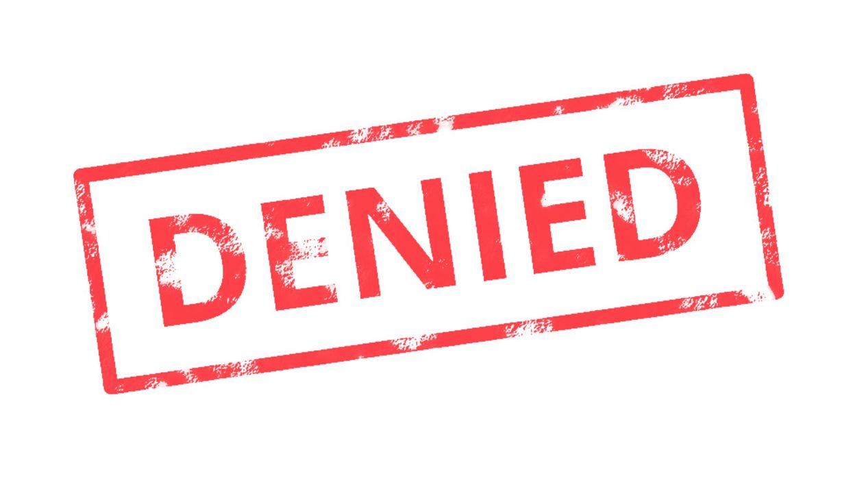 "DENIED" red stamp on white background