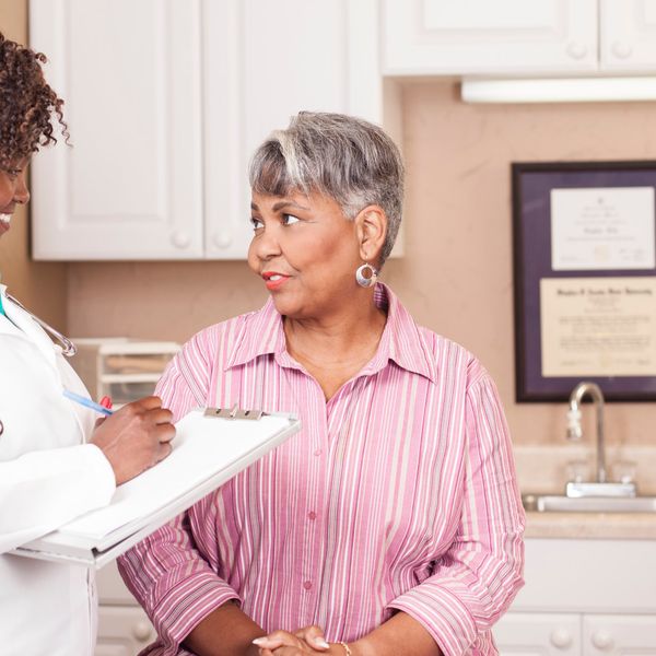 Doctor conducts medical consultation with senior adult patient About Vaginal Dryness